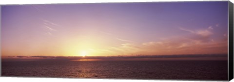 Framed Sun Setting Behind Clouds over the Sea Print