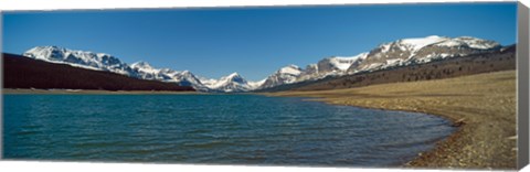 Framed Lake with snow covered mountains in the background, Sherburne Lake, US Glacier National Park, Montana, USA Print