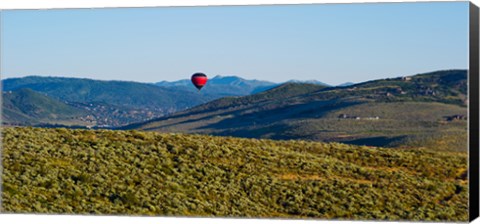 Framed Hot air balloon flying in a valley, Park City, Utah, USA Print