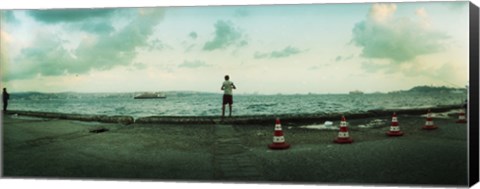 Framed Boy looking out on the Bosphorus Strait, Istanbul, Turkey Print