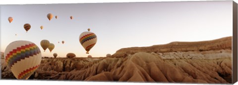 Framed Hot air balloons crossing a plateau, Cappadocia, Central Anatolia Region, Turkey Print