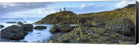Framed People climbing on rocks at Giant's Causeway, Bushmills, County Antrim, Northern Ireland Print