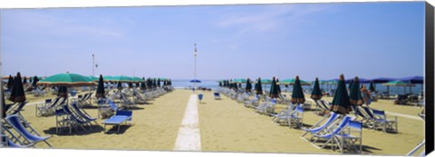 Framed Deck chairs and umbrellas on the beach, Viareggio, Tuscany, Italy Print