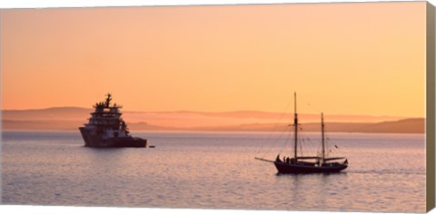 Framed Tugboat and a tall ship in the Baie de Douarnenez at sunrise, Finistere, Brittany, France Print