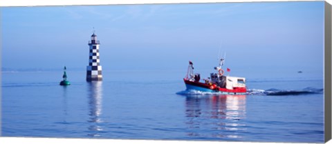 Framed Les Perdrix lighthouse and fishing boat at Loctudy, Brittany, France Print