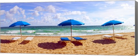 Framed Lounge chairs and beach umbrellas on the beach, Fort Lauderdale Beach, Florida, USA Print