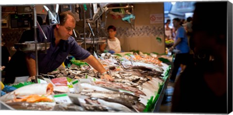 Framed Fishmonger at a fish stall, La Boqueria Market, Ciutat Vella, Barcelona, Catalonia, Spain Print