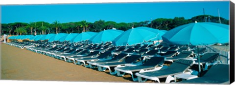 Framed Parasols with lounge chairs on a private beach in summer morning light, French Riviera, France Print