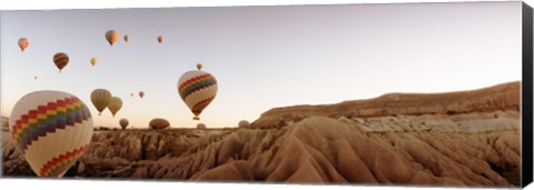 Framed Hot air balloons crossing a plateau, Cappadocia, Central Anatolia Region, Turkey Print