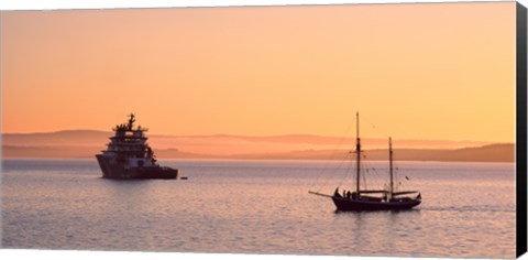 Framed Tugboat and a tall ship in the Baie de Douarnenez at sunrise, Finistere, Brittany, France Print