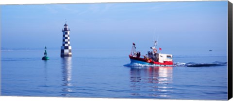 Framed Les Perdrix lighthouse and fishing boat at Loctudy, Brittany, France Print