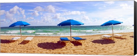 Framed Lounge chairs and beach umbrellas on the beach, Fort Lauderdale Beach, Florida, USA Print