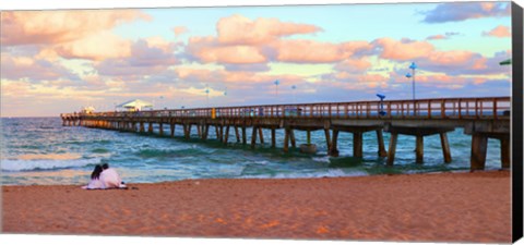 Framed Couple sitting on the beach at sunset, Fort Lauderdale, Florida, USA Print