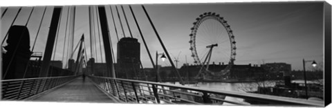 Framed Bridge across a river with a ferris wheel, Golden Jubilee Bridge, Thames River, Millennium Wheel, London, England Print