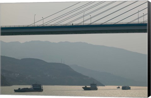 Framed Container ships passing a newly constructed bridge on the Yangtze River, Wanzhou, Chongqing Province, China Print