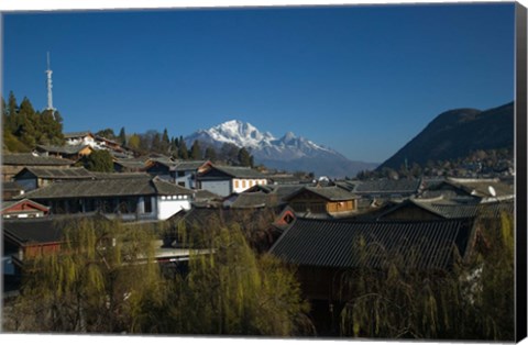 Framed High angle view of houses and Jade Dragon Snow Mountain viewed from Mu Family Mansion, Old Town, Lijiang, Yunnan Province, China Print