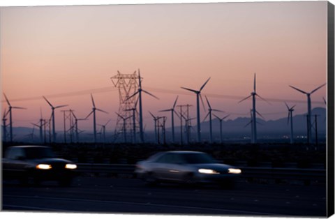 Framed Cars moving on road with wind turbines in background at dusk, Palm Springs, Riverside County, California, USA Print