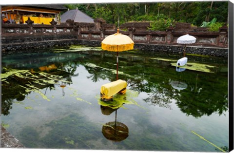 Framed Covered stones with umbrella in ritual pool at holy spring temple, Tirta Empul Temple, Tampaksiring, Bali, Indonesia Print