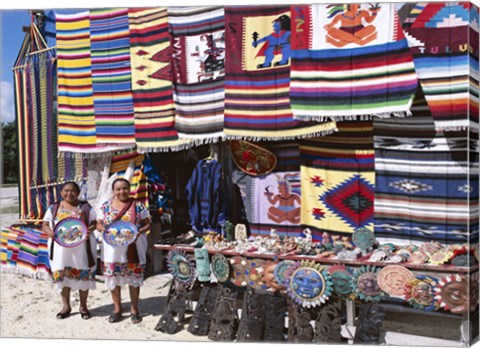 Framed Two female vendors dressed in Mayan costumes displaying products Print