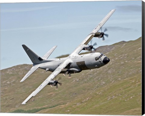 Framed C-130J Super Hercules low flying over North Wales on a training flight Print