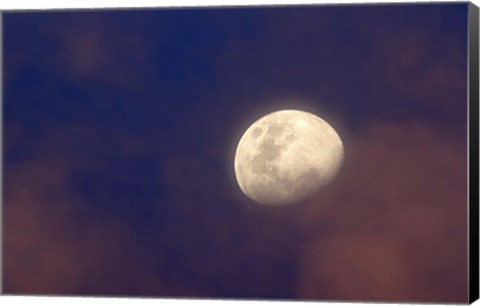 Framed moon between colorful clouds at sunset Print