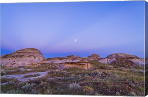 Framed Gibbous moon and crepuscular rays over Dinosaur Provincial Park, Canada Print