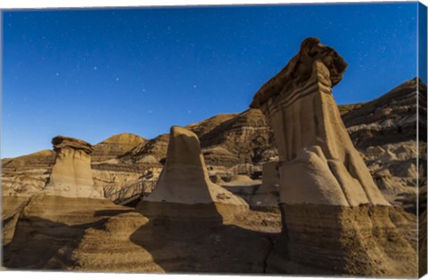 Framed Stars over the hoodoos in the Red Deer River valley, Alberta, Canada Print