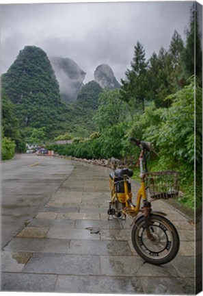 Framed Bicycle sits in front of the Guilin Mountains, Guilin, Yangshuo, China Print