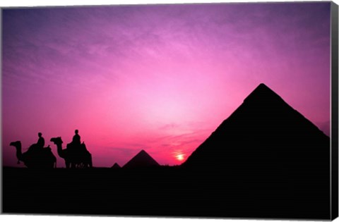 Framed Colorful Sunset Silhouetting Men and Camels at the Great Pyramids of Giza, Egypt Print