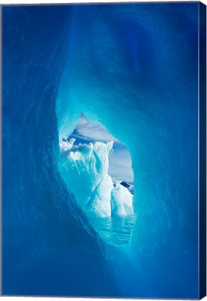 Framed Antarctica, Iceberg framed in arch of another in Wilhelmina Bay. Print