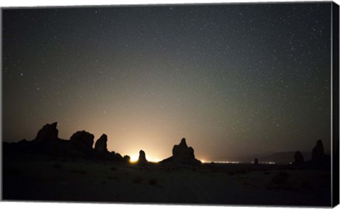 Framed Large tufa formations at Trona Pinnacles against a backdrop of stars Print