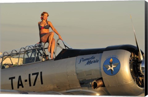 Framed 1940&#39;s style pin-up girl sitting on the cockpit of a World War II T-6 Texan Print