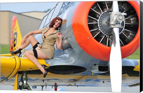 Framed 1940&#39;s style pin-up girl posing on a T-6 aircraft Print