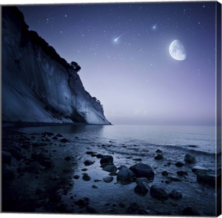 Framed Rising moon over ocean and mountains against starry sky Print