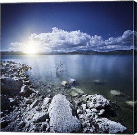 Framed Tranquil lake and rocky shore with sun over horizon, Sardinia, Italy Print