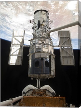 Framed Space Shuttle Atlantis&#39; arm lifts the Hubble Space Telescope from the cargo bay Print