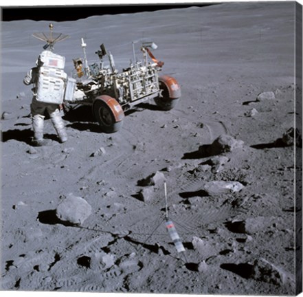 Framed Astronaut walking near the lunar rover on the moon, Apollo 16 Print