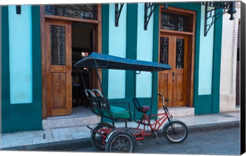 Framed Cuba, Camaquey, bike carriage and buildings Print