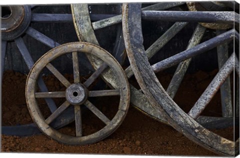 Framed Rustic wagon wheels on movie set, Cuba Print