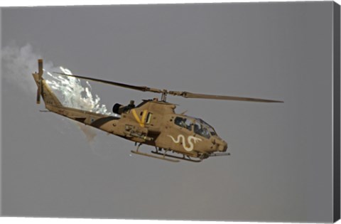 Framed AH-1S Tzefa of the Israeli Air Force dispenses flares Print