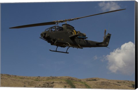 Framed AH-1F Tzefa of the Israeli Air Force flying over the Golan Heights, Israel Print