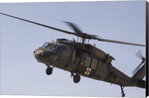 Framed UH-60 Blackhawk Medivac helicopter flies over Camp Warhorse Print