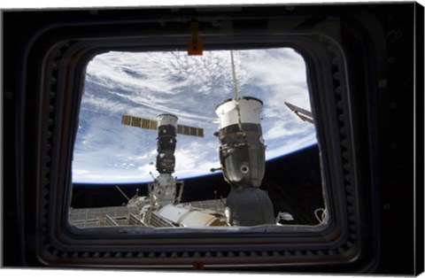 Framed Two Russian Spacecraft Docked with the International Space Station, as seen from Space Shuttle Discovery&#39;s Flight Deck Window Print