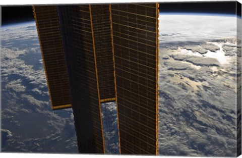 Framed Solar Panels of the International Space Station Backdropped by a Blue and White Earth Print