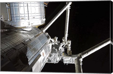 Framed Robotic Arm of the Japanese Experiment Module assists in installing components on the Japanese Exposed Facility Print