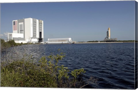 Framed Viewed across the Basin, Space Shuttle Atlantis Crawls Toward the Launch Pad Print