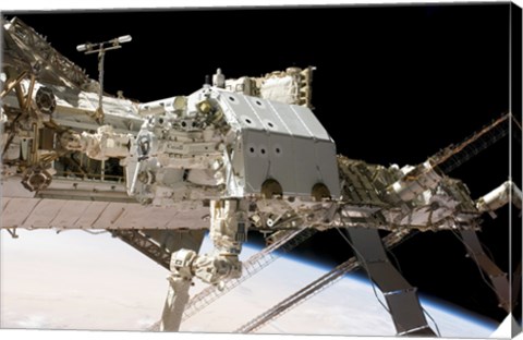 Framed Canadian-Built Dextre Robotic System in the Grasp of the Robotic Canadarm2 Print