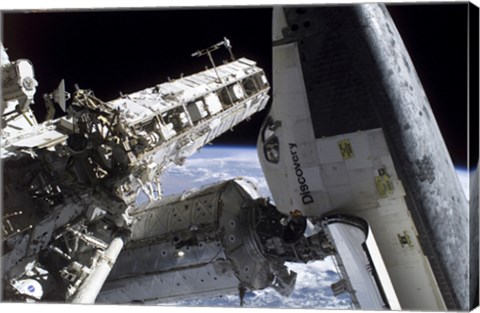 Framed Space Shuttle Discovery Docked to the International Space Station Print