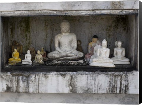 Framed Niche at Ruwanwelisaya Dagoba filled with Buddha statues as offerings, Anuradhapura, Sri Lanka Print