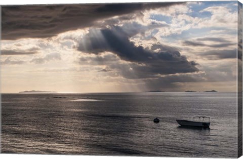 Framed Dramatic light over a little boat, Mamanucas Islands, Fiji, South Pacific Print